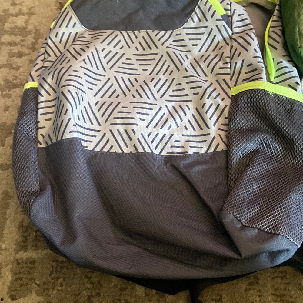 Grey kids backpack small stain on shoulder strap